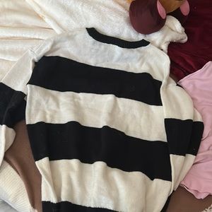 Selling this black and white striped shirt